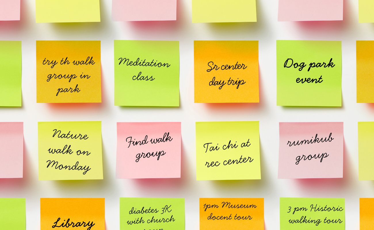 P:ink yello and green sticky notes with reminders written on them for events coming up