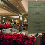The Windsor Court Hotel dining area decorated with lots of pointsettias for Christmas and the afternoon tea menu.