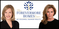 Two smiling women in black outfits with a logo for Forever Homes Coldwell Bank Realty group in the center.
