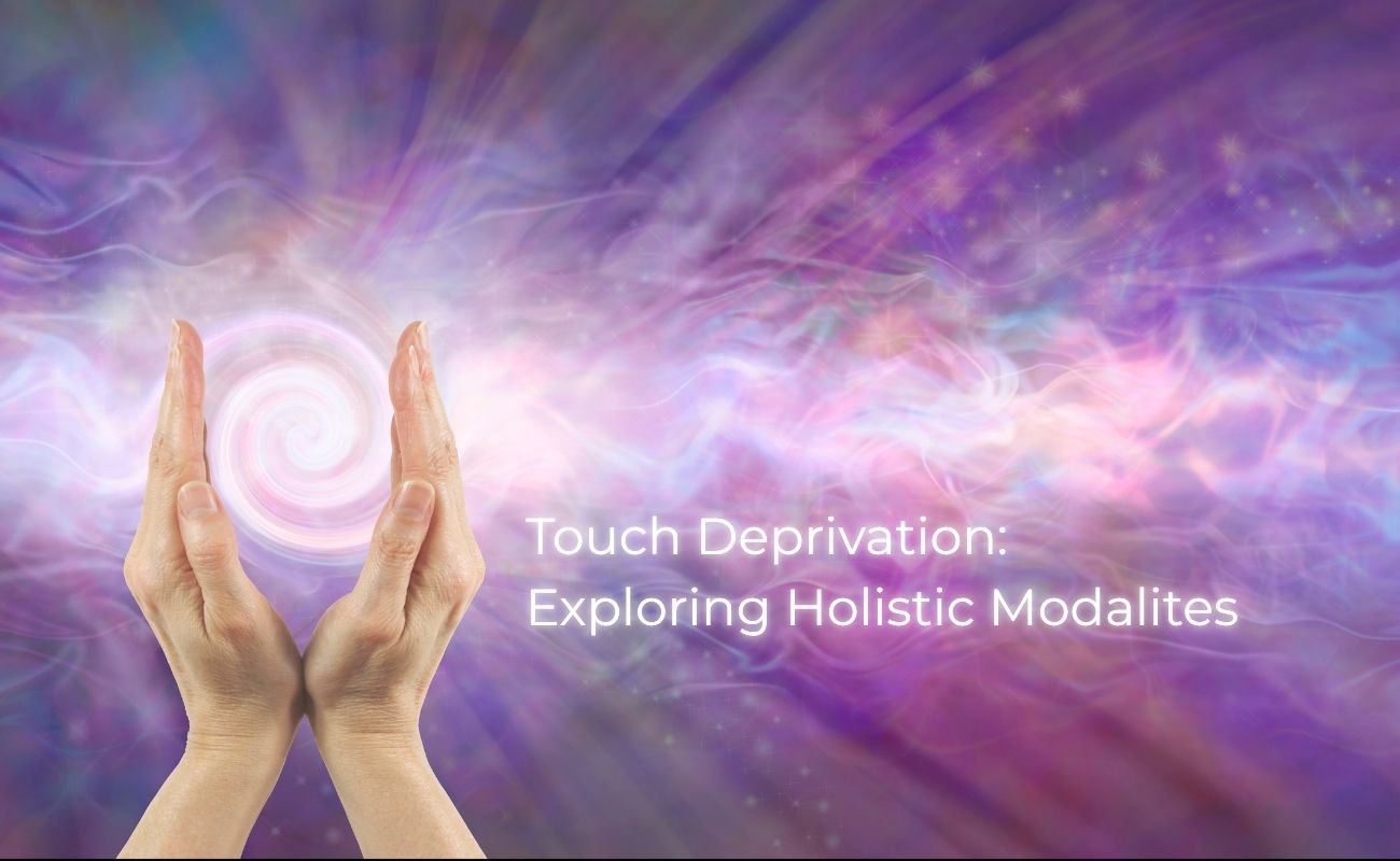 A photo of two hands holding a ball of light between them. The catpiton reads "Touch Deprivation: Exploring Holistic Modalities"
