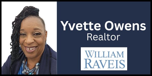 Smiling professional black woman with business card that reads "Yvette Owens Realtor" and teh logo for William Raveis.