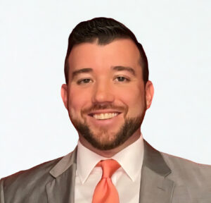 Smiling young man in a suit and tie.